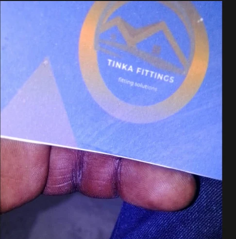 The supplied Tinka Fittings business card with its gold roof emblem