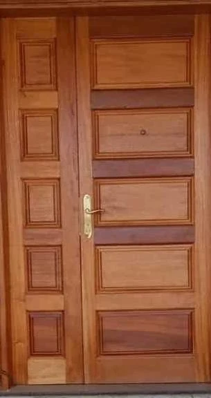 Client-supplied paneled timber door with matching side panel